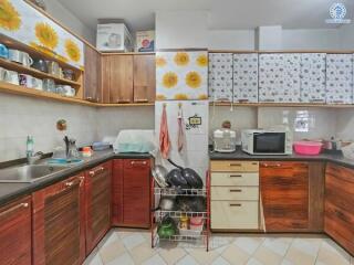 Bright and colorful kitchen with sunflower decorations and modern appliances