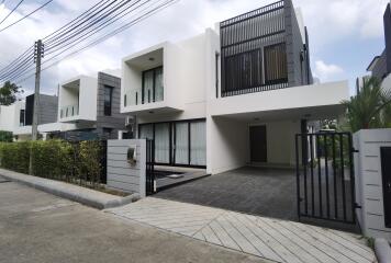 Modern suburban house with a spacious driveway and elegant architectural design