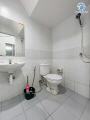 Clean white tiled bathroom with modern fixtures