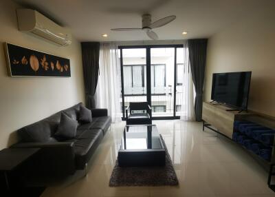 Spacious modern living room with balcony access