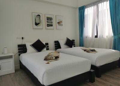 Modern twin bedroom with stylish decor
