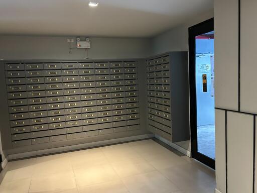Interior view of a building lobby with multiple mailboxes