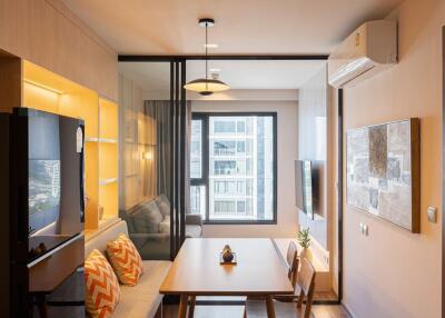 Modern and cozy living room with balcony access and ample natural light