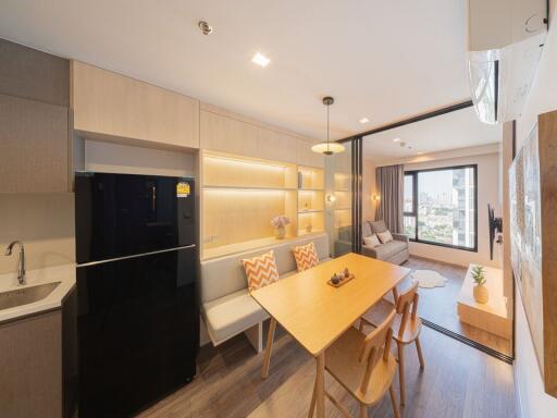 Modern kitchen with dining area and city view