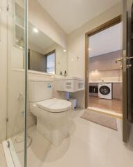 Modern bathroom with integrated laundry area