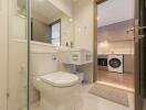 Modern bathroom with integrated laundry area