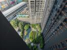 High-rise urban building view showcasing surrounding architecture and garden