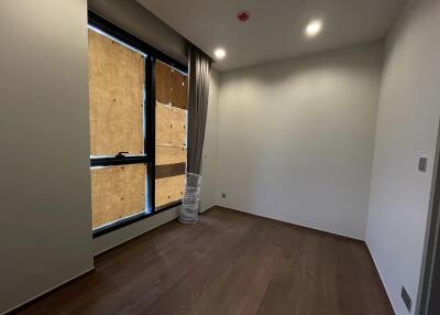 Unfurnished bedroom with wooden flooring and large window