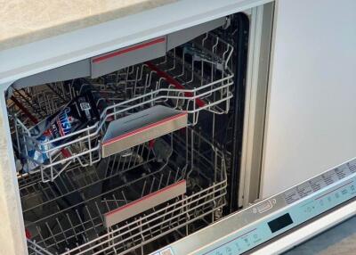 Modern Bosch dishwasher integrated into kitchen cabinetry