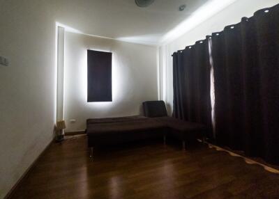 Spacious bedroom with minimalist design and parquet flooring