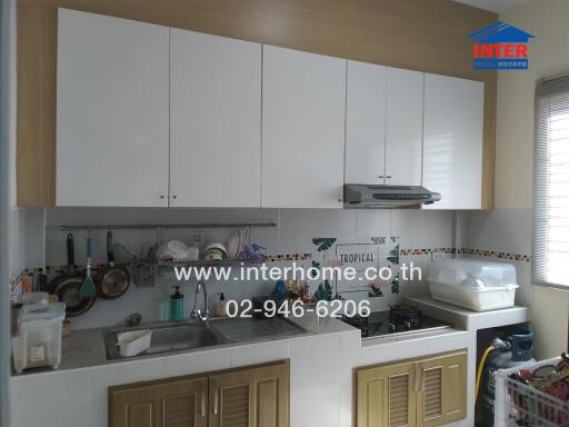 Compact modern kitchen with ample cabinets and appliances