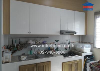 Compact modern kitchen with ample cabinets and appliances
