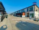 Row of townhouses in a residential neighborhood under clear blue sky