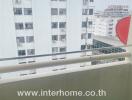 apartment balcony overlooking other apartment buildings