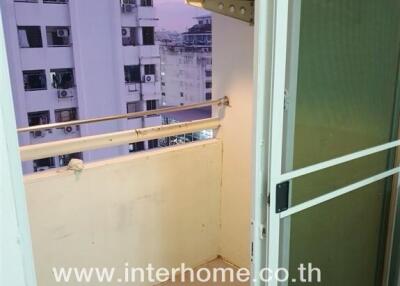 Small balcony with open view and air conditioning unit