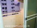 Small balcony with open view and air conditioning unit