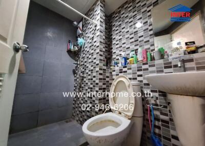 Compact bathroom with modern tile design