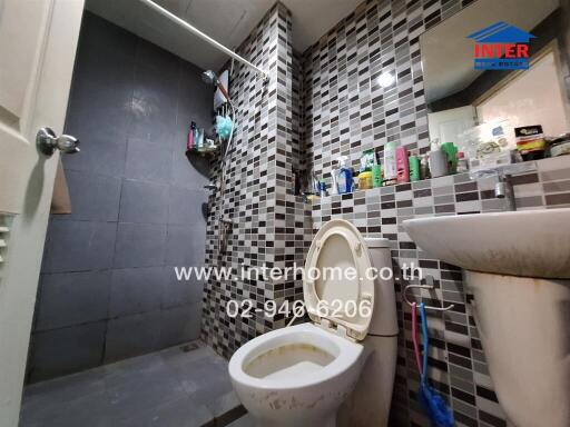 Compact bathroom with modern tile design