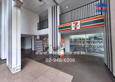 Modern commercial space with 7-Eleven store and loft area
