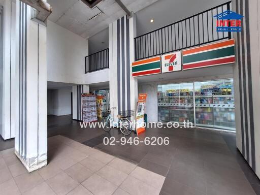 Modern commercial space with 7-Eleven store and loft area