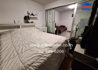 Spacious bedroom with mirrored wardrobe and well-maintained interiors