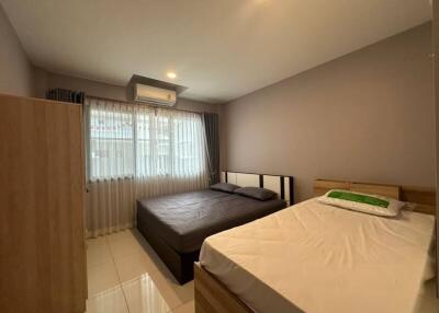 Spacious and well-furnished bedroom with modern amenities