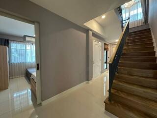 Spacious entryway with staircase and access to the main living areas
