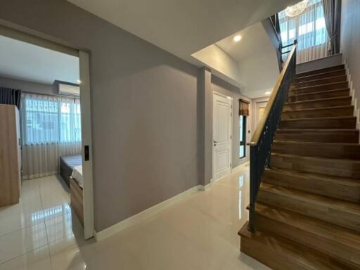 Spacious entryway with staircase and access to the main living areas