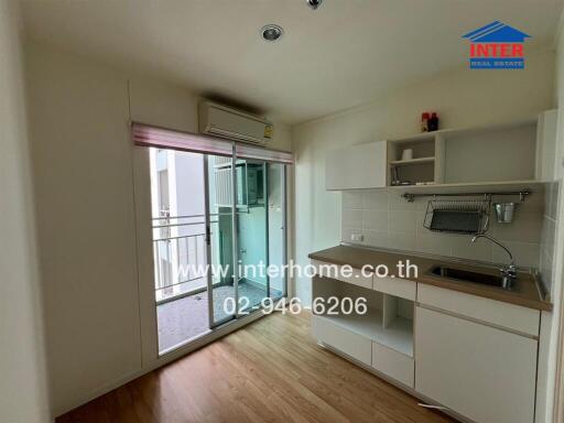 Modern kitchen with balcony access in an apartment