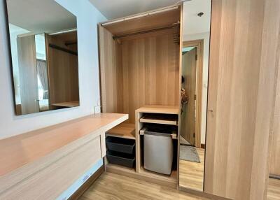 Modern bedroom with wooden built-in wardrobe and vanity
