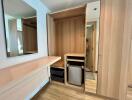 Modern bedroom with wooden built-in wardrobe and vanity