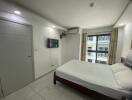 Spacious bedroom with modern amenities and natural light