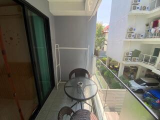 Small balcony overlooking the apartment complex area
