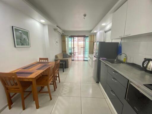 Spacious kitchen with dining area and modern appliances