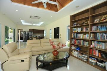 Spacious living room with modern furniture and built-in bookshelves