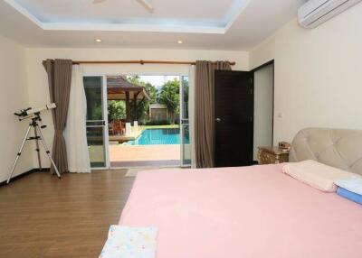 Spacious bedroom with direct pool access