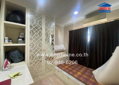 Elegant bedroom with built-in wardrobes and warm lighting