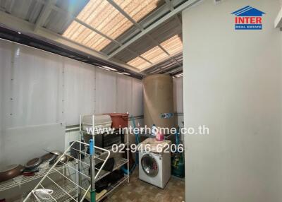Interior utility room with storage and appliances
