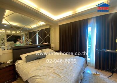 Elegant modern bedroom with ambient lighting and mirrored decor