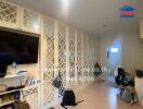 Spacious living room with decorative partition and modern amenities