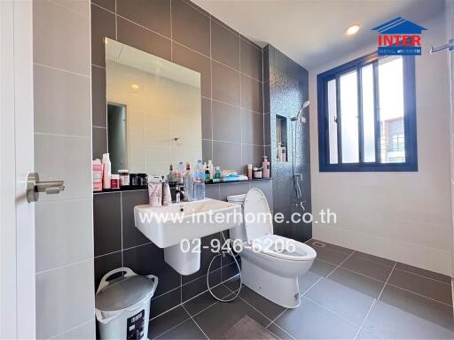 Modern bathroom with natural light and stylish fixtures