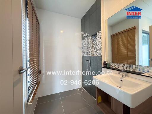 Modern bathroom with natural light and elegant fixtures