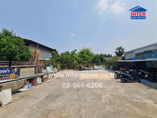 Open courtyard of a commercial property with parking space