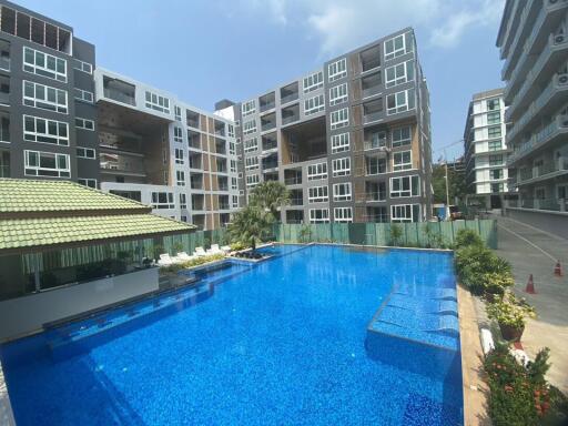 Modern apartment buildings with a large communal swimming pool