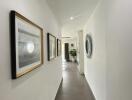 Bright and modern hallway with framed artwork and well-lit ambiance