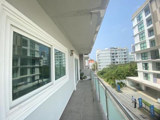 Spacious balcony overlooking neighboring buildings