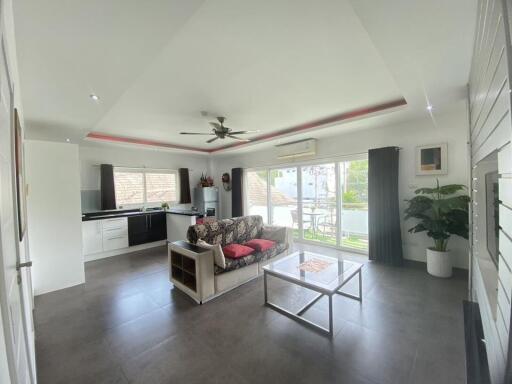 Spacious living room with integrated modern kitchen