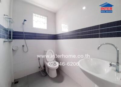 Modern white bathroom with sleek blue tile accents