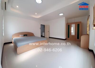 Spacious bedroom with modern interior and ample lighting
