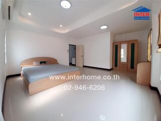 Spacious bedroom with modern interior and ample lighting